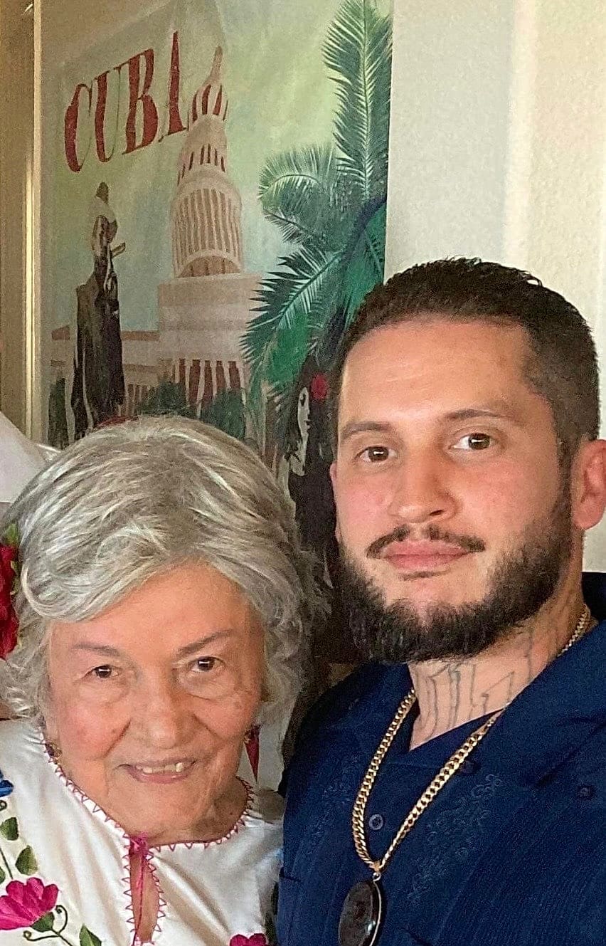 Raymond Gil, founder of Pixel Valley Painting, with his grandmother
